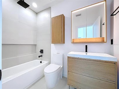 Modern bathroom remodel Tampa — custom shower niche and premium tile work