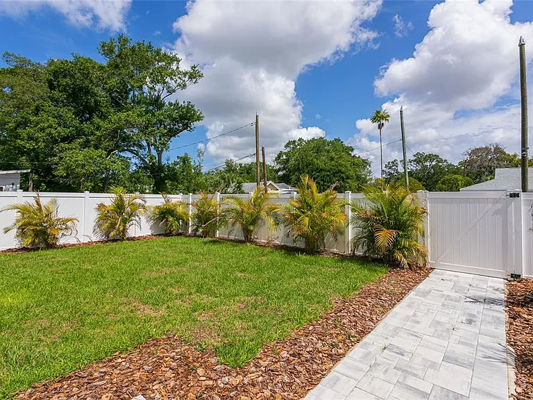 Paver driveway and landscaping installation St. Petersburg FL — concrete pavers and garden beds