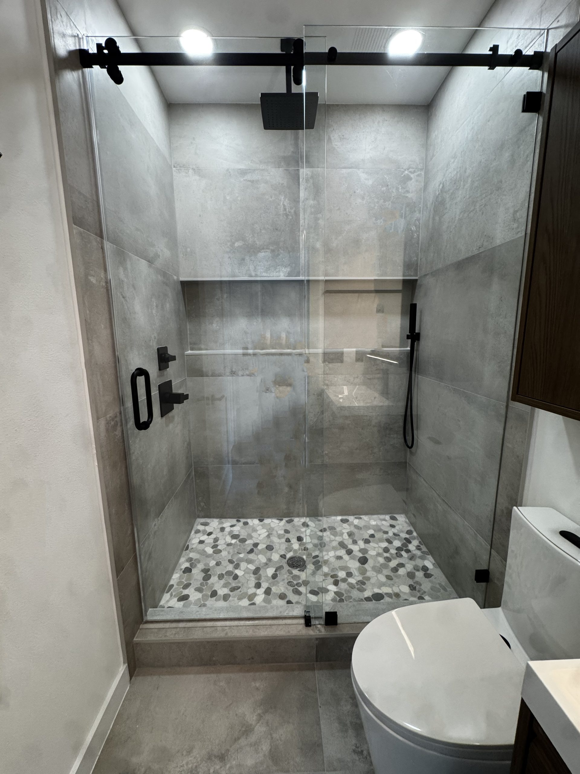 Tile installation bathroom Tampa Bay — large format porcelain tile and waterproofing