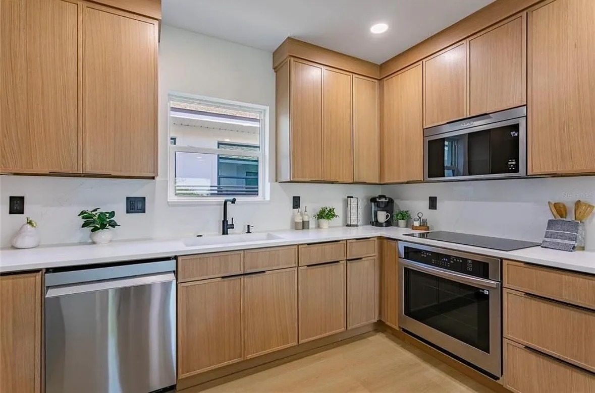 Kitchen remodel Tampa FL — custom cabinets and updated lighting